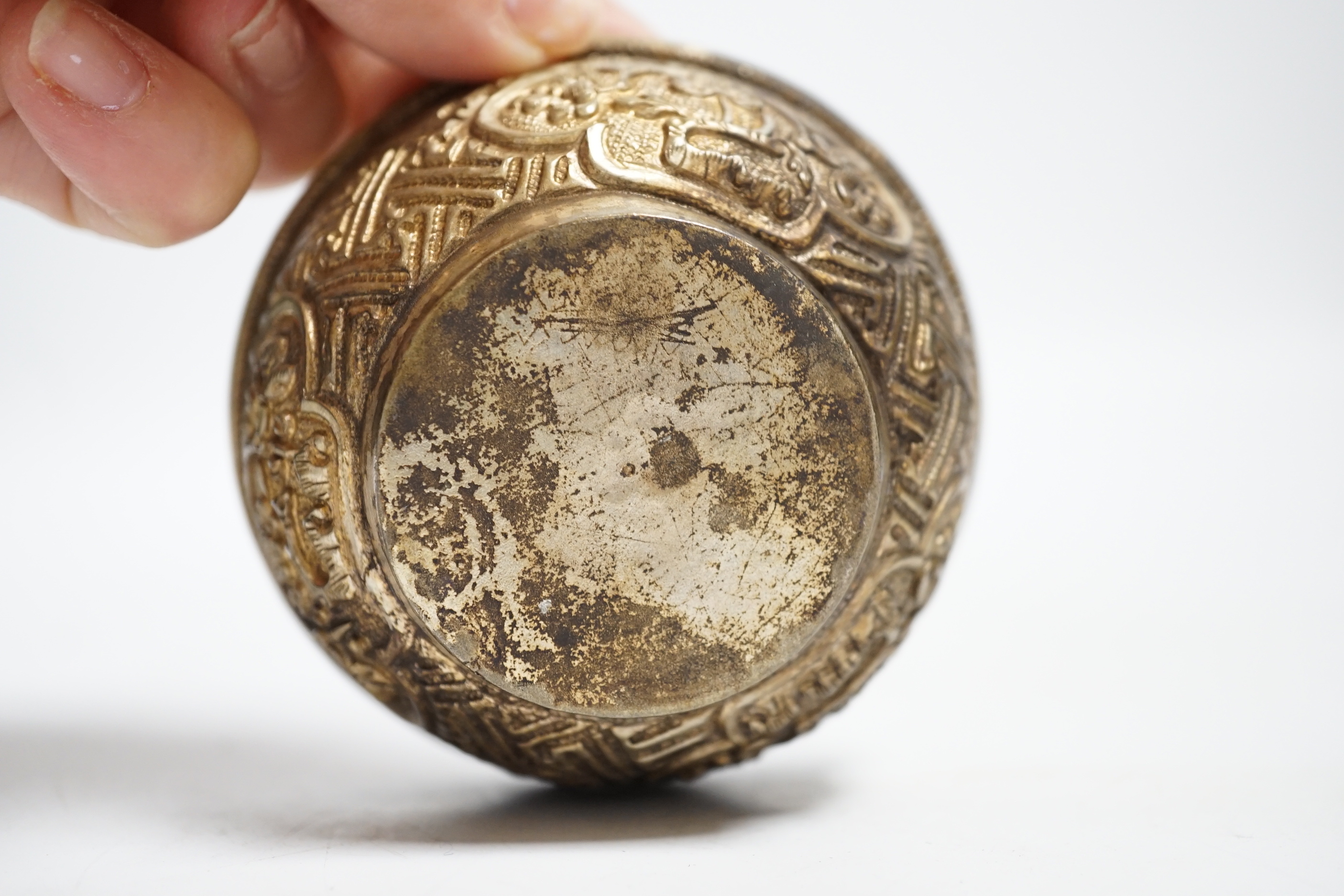 A Nepalese white metal tea bowl, 7.5cm diameter
